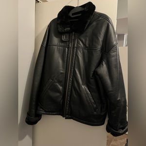 Women’s black leather jacket.
